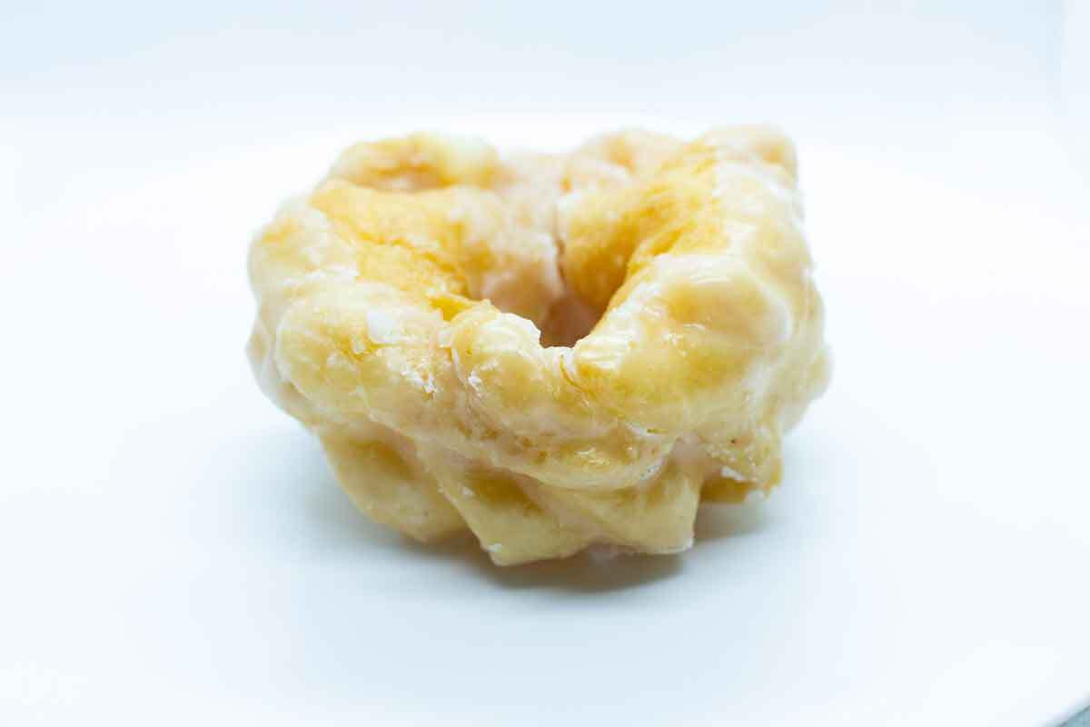 A photograph of a Honey Cruller Doughnut